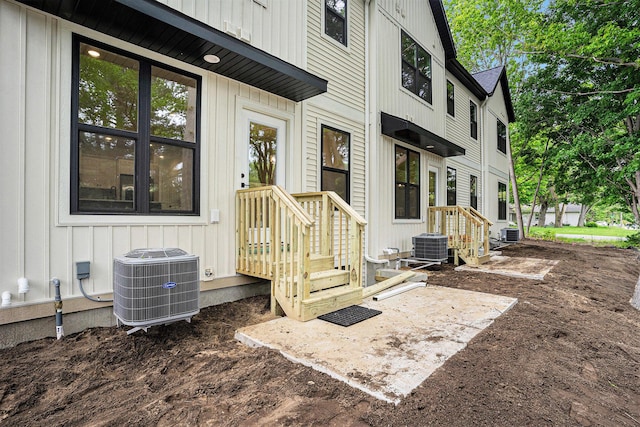 1979 N Shorewood Ln Unit 7, Holland, MI 49423 - property entrance with central air condition unit and board and batten siding