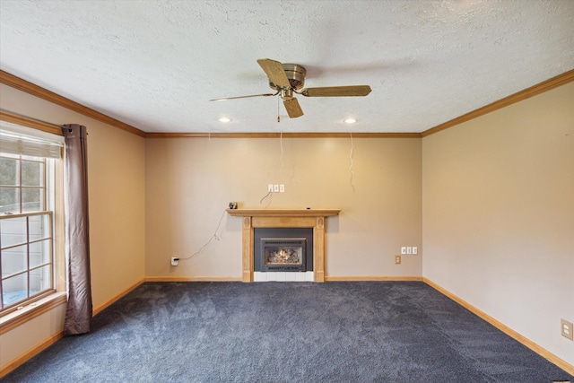 unfurnished living room featuring a textured ceiling, dark carpet, ceiling fan, and ornamental molding