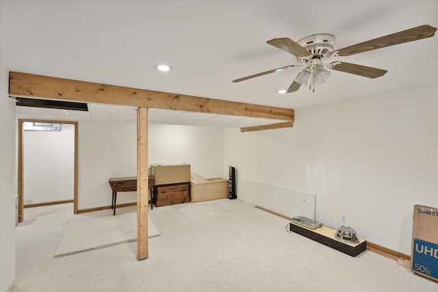 basement with carpet and ceiling fan