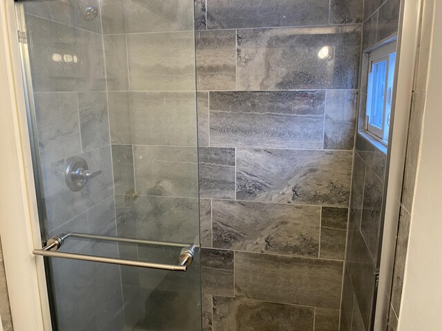 bathroom featuring an enclosed shower