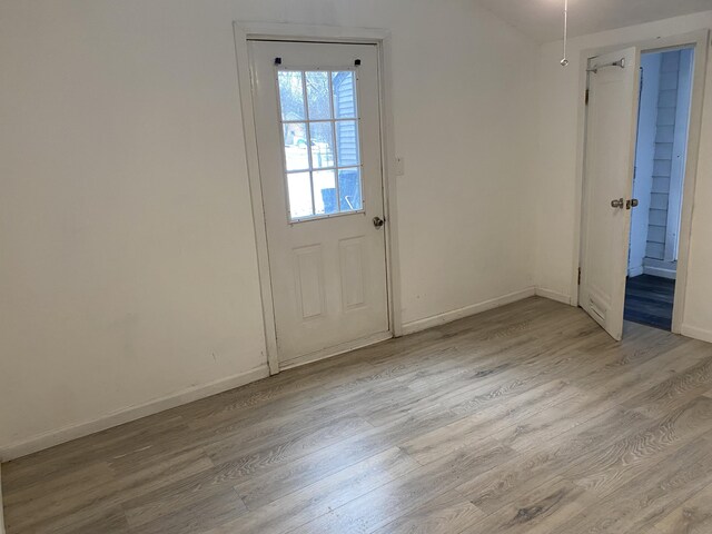 doorway to outside with light wood-type flooring