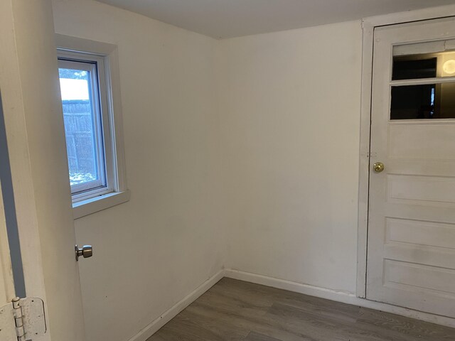 empty room with dark hardwood / wood-style floors