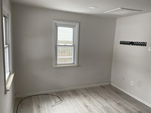 spare room featuring light hardwood / wood-style floors