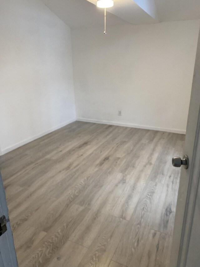 spare room featuring hardwood / wood-style floors