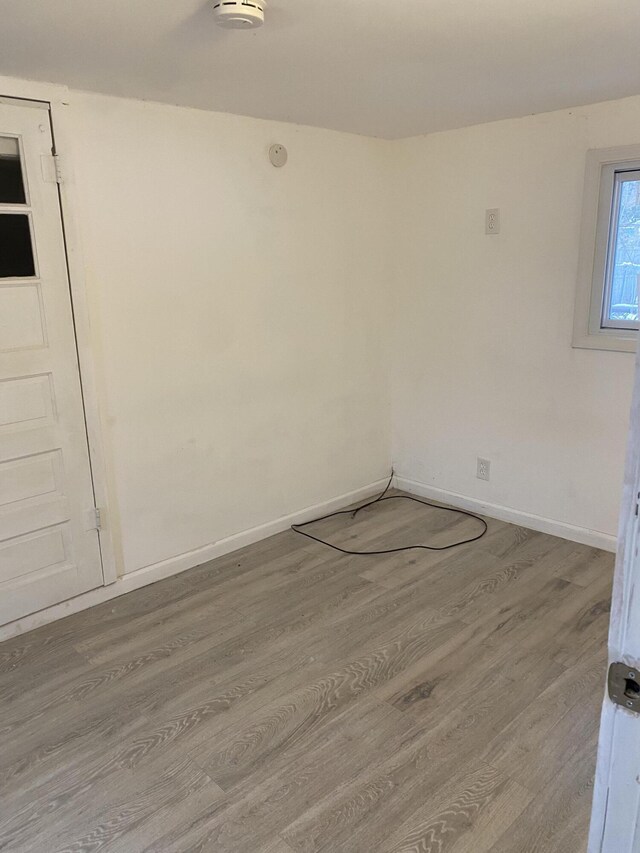 spare room with hardwood / wood-style floors