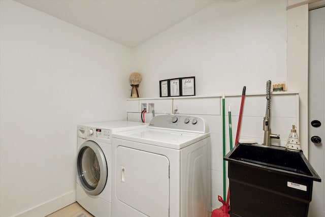 laundry area with sink and washer and dryer