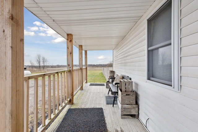 wooden terrace with a porch