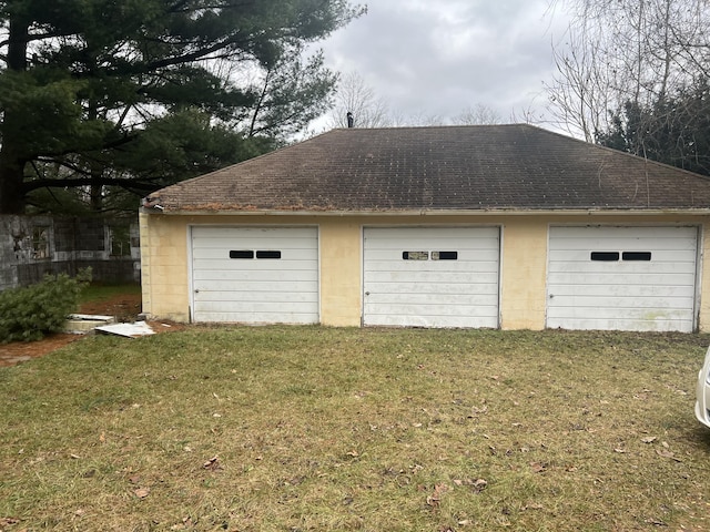 garage with a lawn