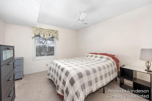 bedroom with ceiling fan and light carpet