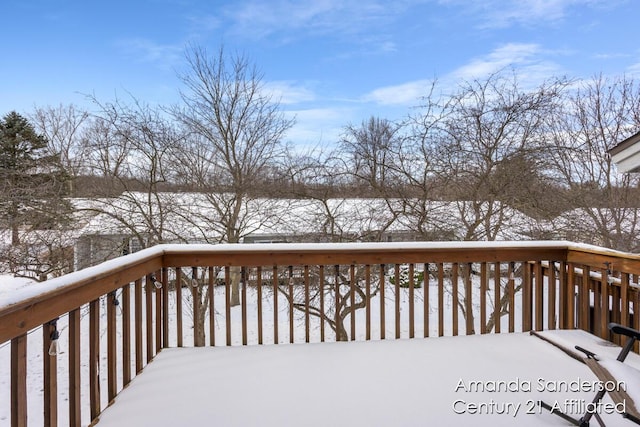 view of snow covered deck