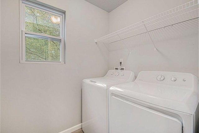 clothes washing area featuring washing machine and dryer