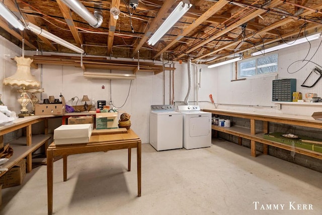 basement with a workshop area and washer and clothes dryer