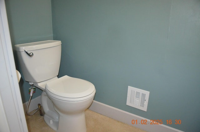 bathroom featuring toilet