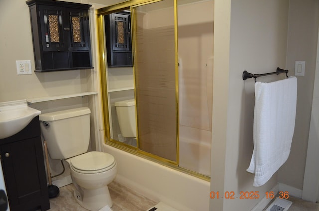 full bathroom featuring combined bath / shower with glass door, vanity, and toilet