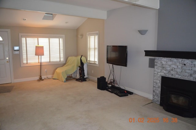 interior space featuring a fireplace, light colored carpet, and lofted ceiling with beams