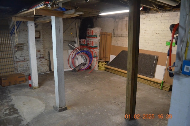 basement with brick wall