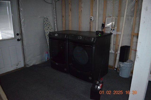 laundry area with independent washer and dryer