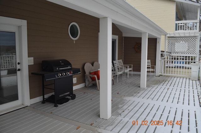 wooden deck featuring grilling area