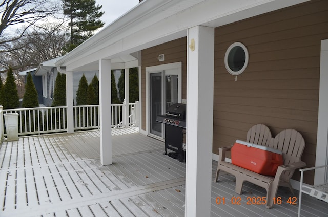 wooden terrace featuring grilling area