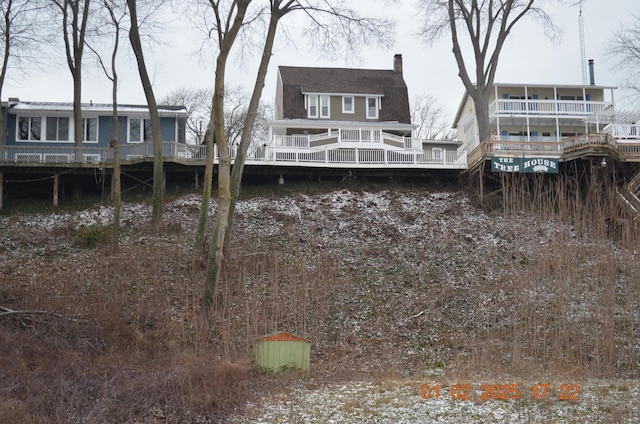 back of house featuring a water view