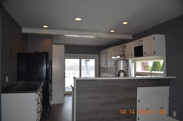 kitchen featuring white cabinets, recessed lighting, open shelves, dark countertops, and a peninsula