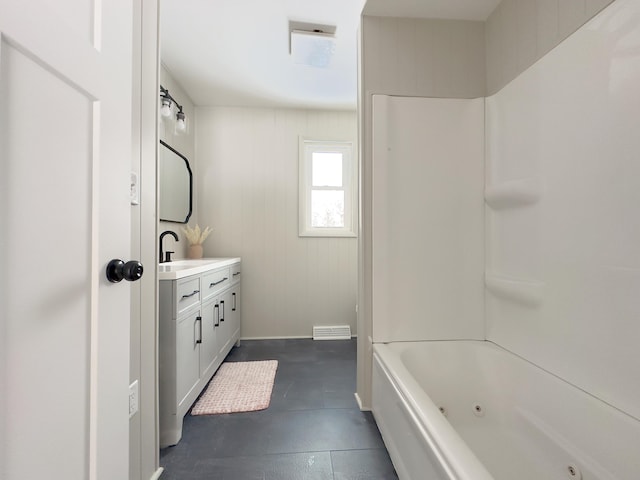 bathroom with tub / shower combination and vanity