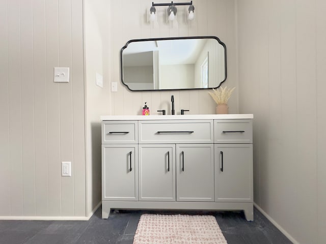 bathroom with wooden walls and vanity