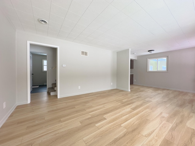 spare room featuring light hardwood / wood-style flooring