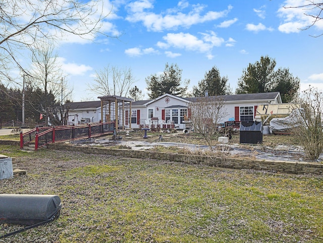 view of front of house featuring a garage and a front yard