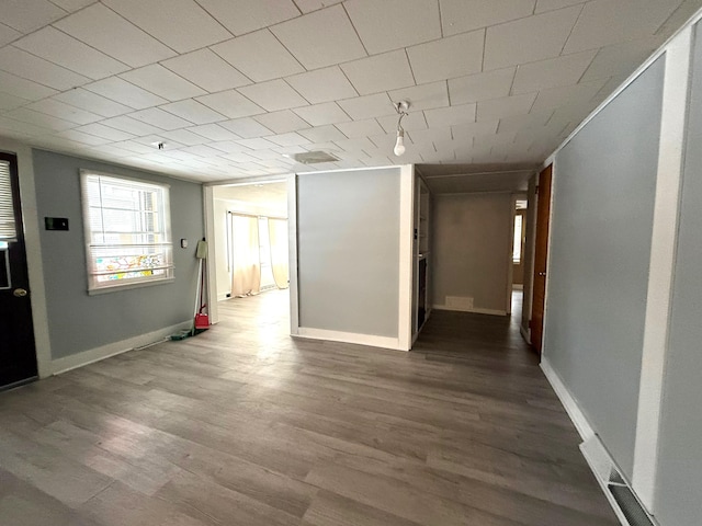 corridor featuring hardwood / wood-style floors