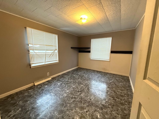 empty room with a baseboard heating unit