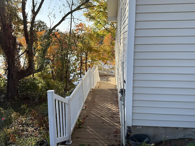 view of side of home featuring a wooden deck