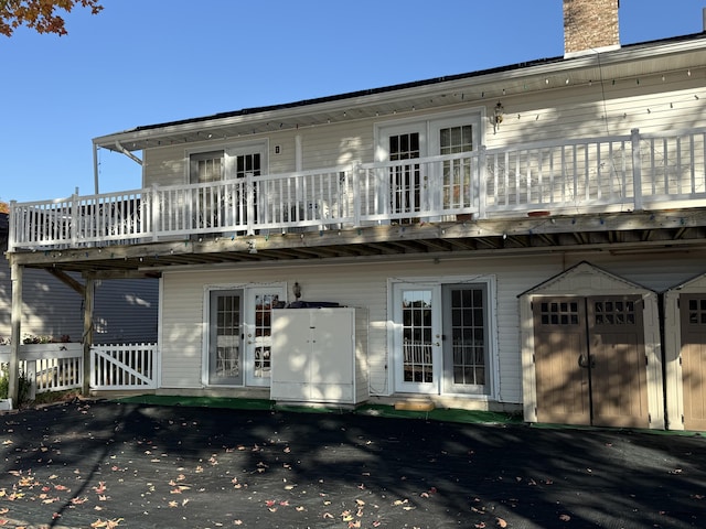 back of house featuring french doors