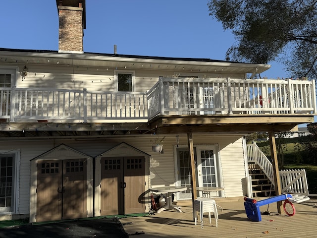 back of property featuring a deck