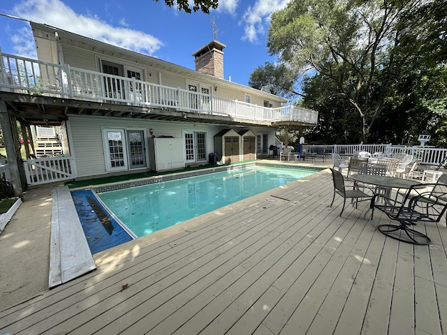 view of pool featuring a wooden deck