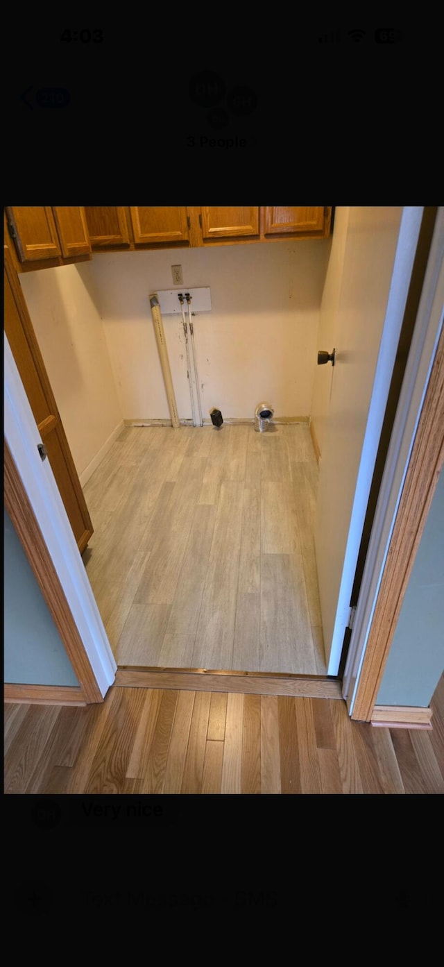 interior space with cabinets and light wood-type flooring