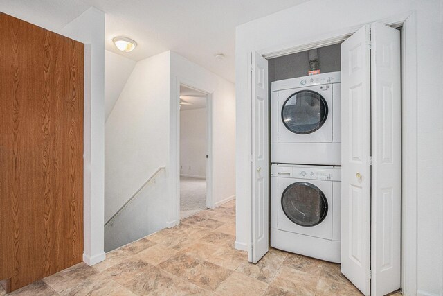 laundry area with stacked washer / dryer