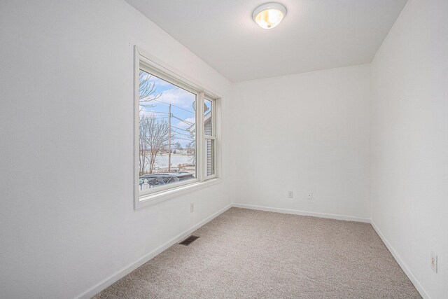 spare room featuring carpet flooring