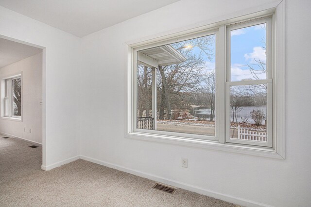 spare room featuring carpet