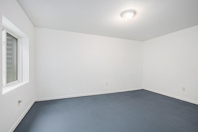 spare room featuring a textured ceiling