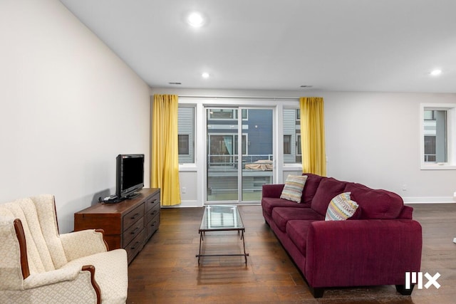 living room with dark hardwood / wood-style floors