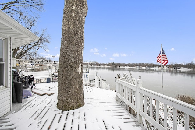 dock area featuring a deck with water view