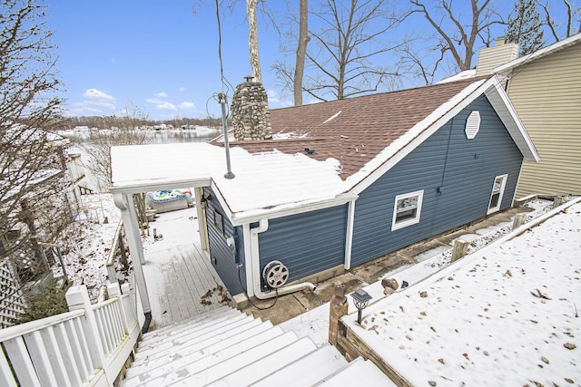 snow covered property featuring a deck