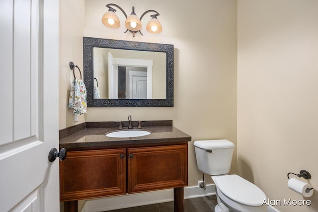 bathroom featuring tile patterned floors, vanity, and toilet