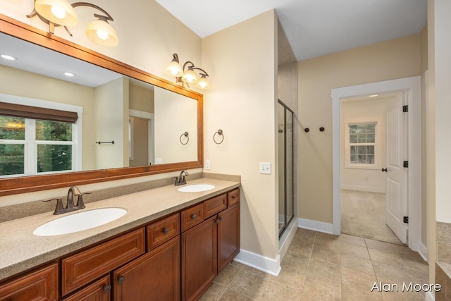 bathroom with vanity and a shower with shower door