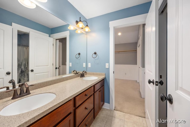 bathroom with tile patterned floors and vanity