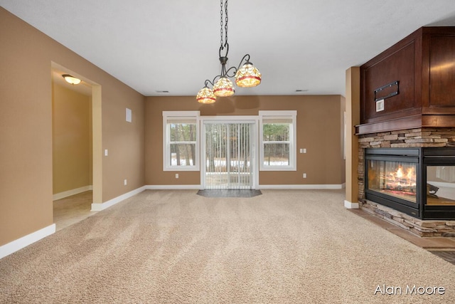 unfurnished living room with a stone fireplace and light carpet