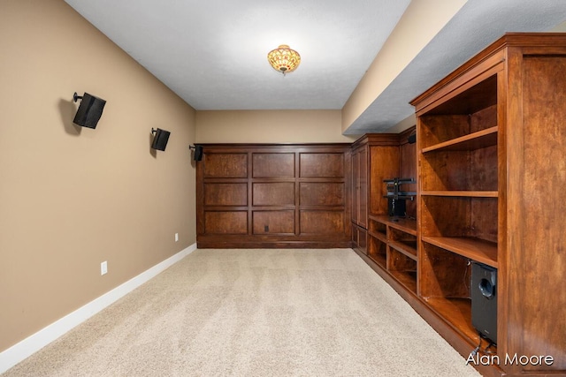 interior space featuring light carpet