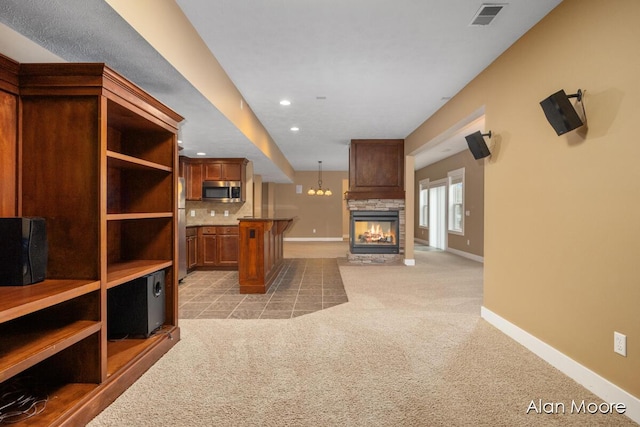 living room with light carpet and a fireplace