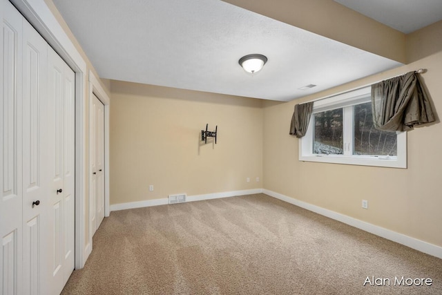 unfurnished bedroom featuring carpet flooring